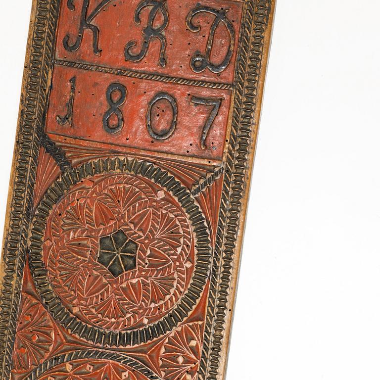 A painted wooden mangle board, Southern Sweden, dated 1807.