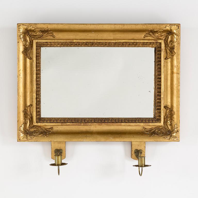 A mid 19th century empire gilt wood wall sconce for two candles.