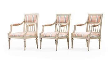 1228. Three Gustavian late 18th century armchairs.