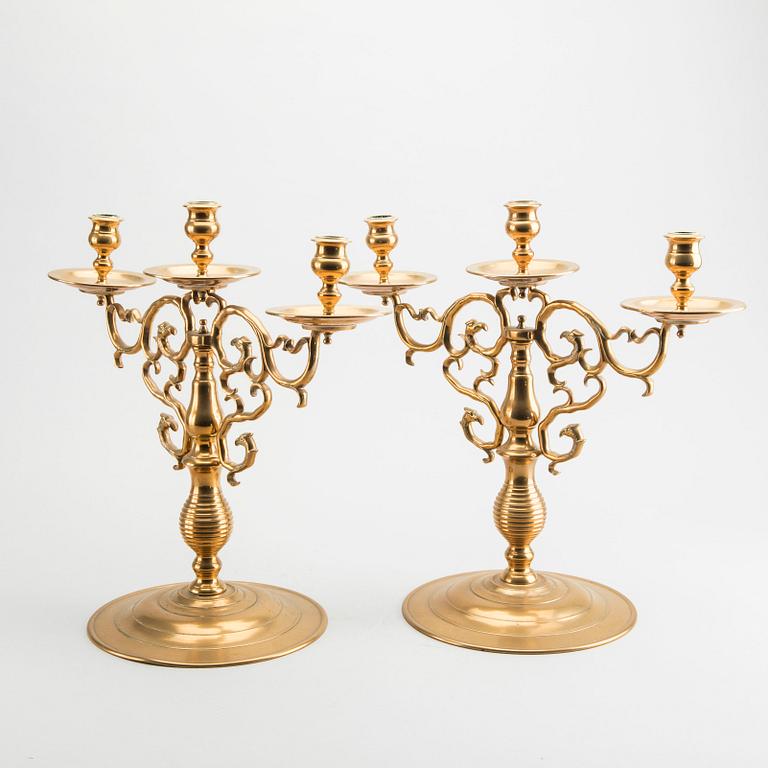 A pair of brass candelabras Gusum around 1900.