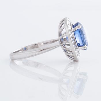 A sapphire and square cut diamond ring.