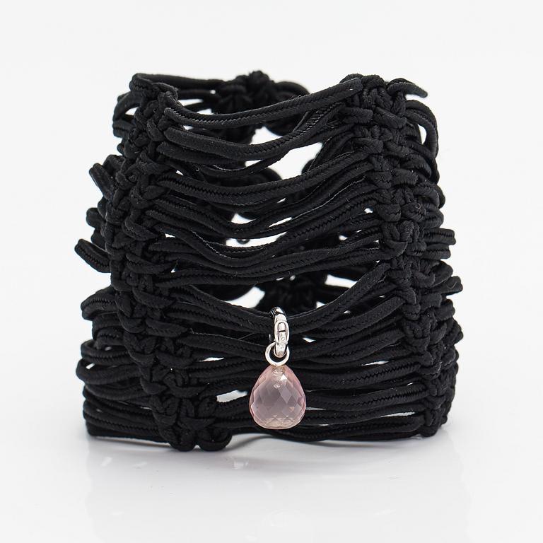 Ole Lynggaard, A satin like band bracelet with an 18K white gold and rose quartz "Sweet drops" pendant.
