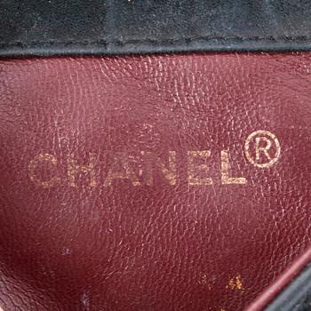 CHANEL, a black quilted leather shoulderbag, "Mini flap bag".