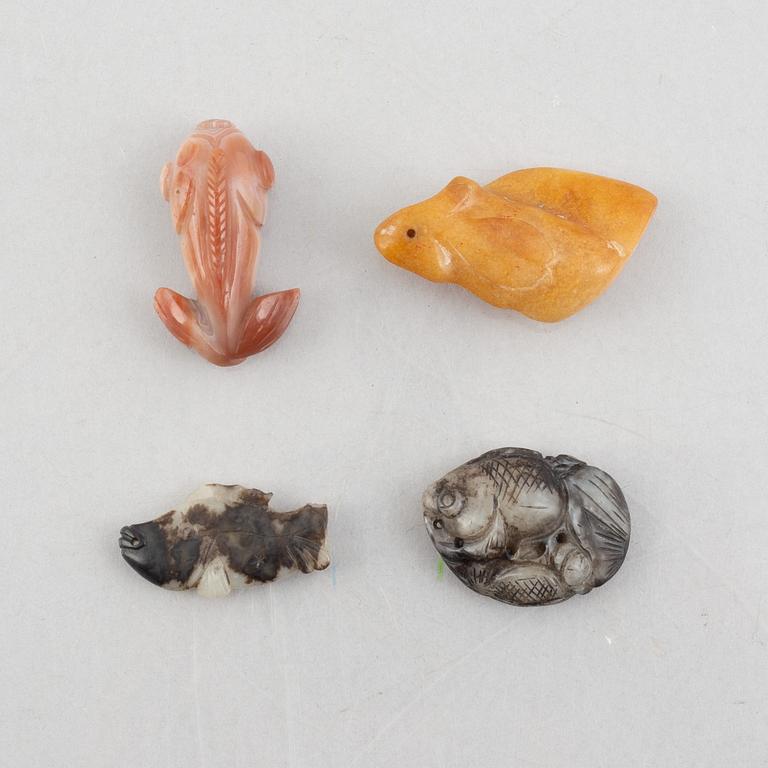 A group of eight Chinese stone charms / pendants, 20th century.