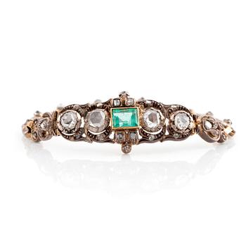 554. A 14K gold and silver bracelet set with an emerald and rose-cut diamonds.