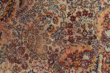 A semi-antique oriental carpet, c. 290 x 195 cm.