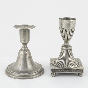 A group of three pewter candlesticks, a salt cellar and four dishes, including Erik Wikgren, Nyköping, (1805-1846).