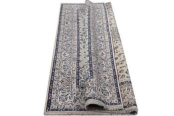 A Nain carpet, part silk, 6 laa, c. 294 x 193 cm.