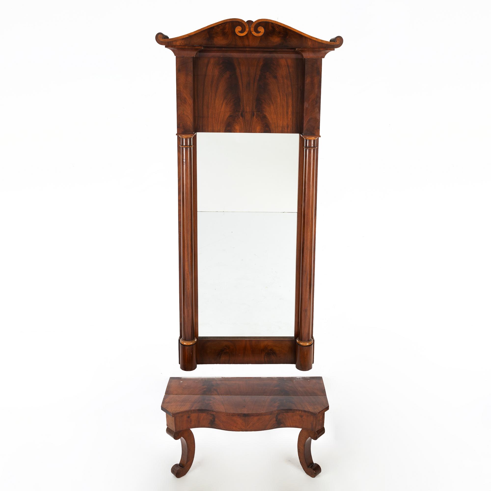 A 19th Century mahogany mirror with a console table.