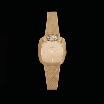 243. A Rolex gold and brilliant cut diamond watch, tot. app. 0.30 cts.