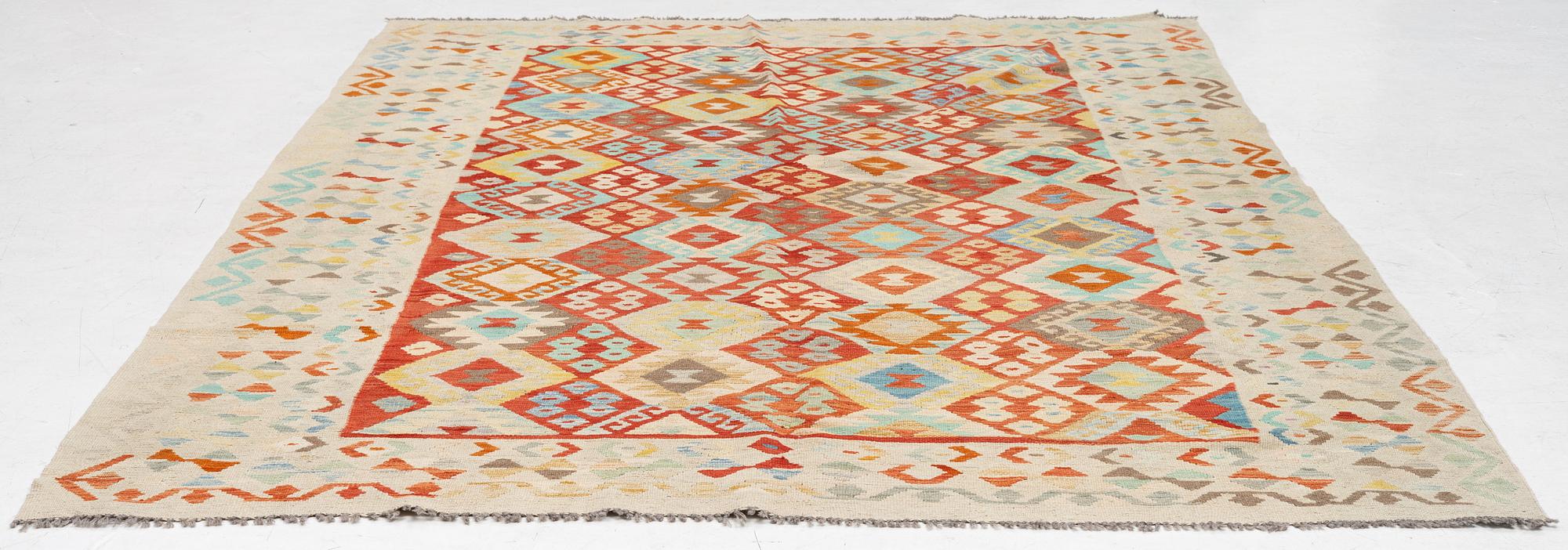 A Kilim carpet. ca 295 x 208 cm.