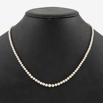 Pearl necklace with graduated cultured pearls, clasp in silver set with pastes, and a pair of pearl earrings,.