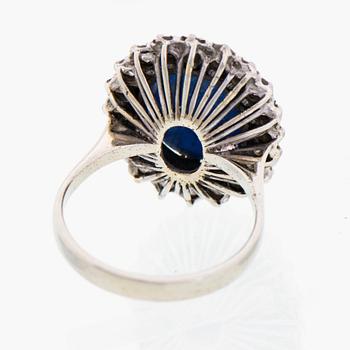 RING, cabochonslipad stjärnsafir, briljantslipade diamanter, 18K vitguld.