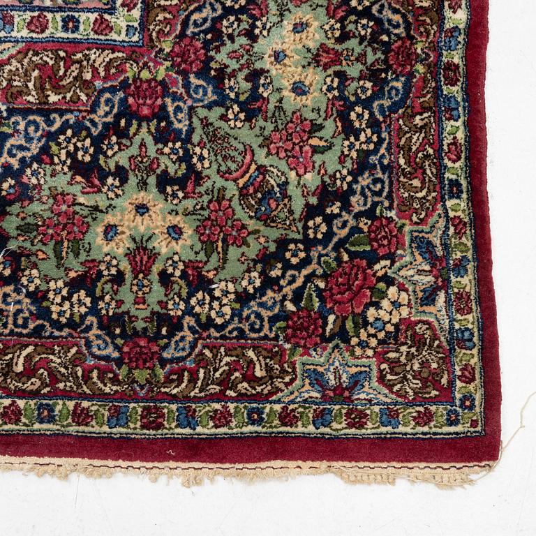 A carpet, Kerman, c. 370 x 275 cm.