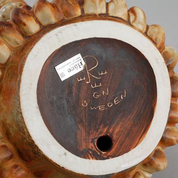 A stoneware figurine, designed by Gunnar Nylund for Rörstrand in the mid 20th century.