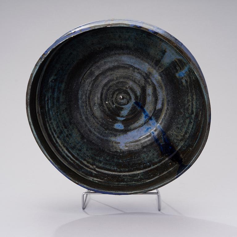 A ceramic bowl signed AMO.