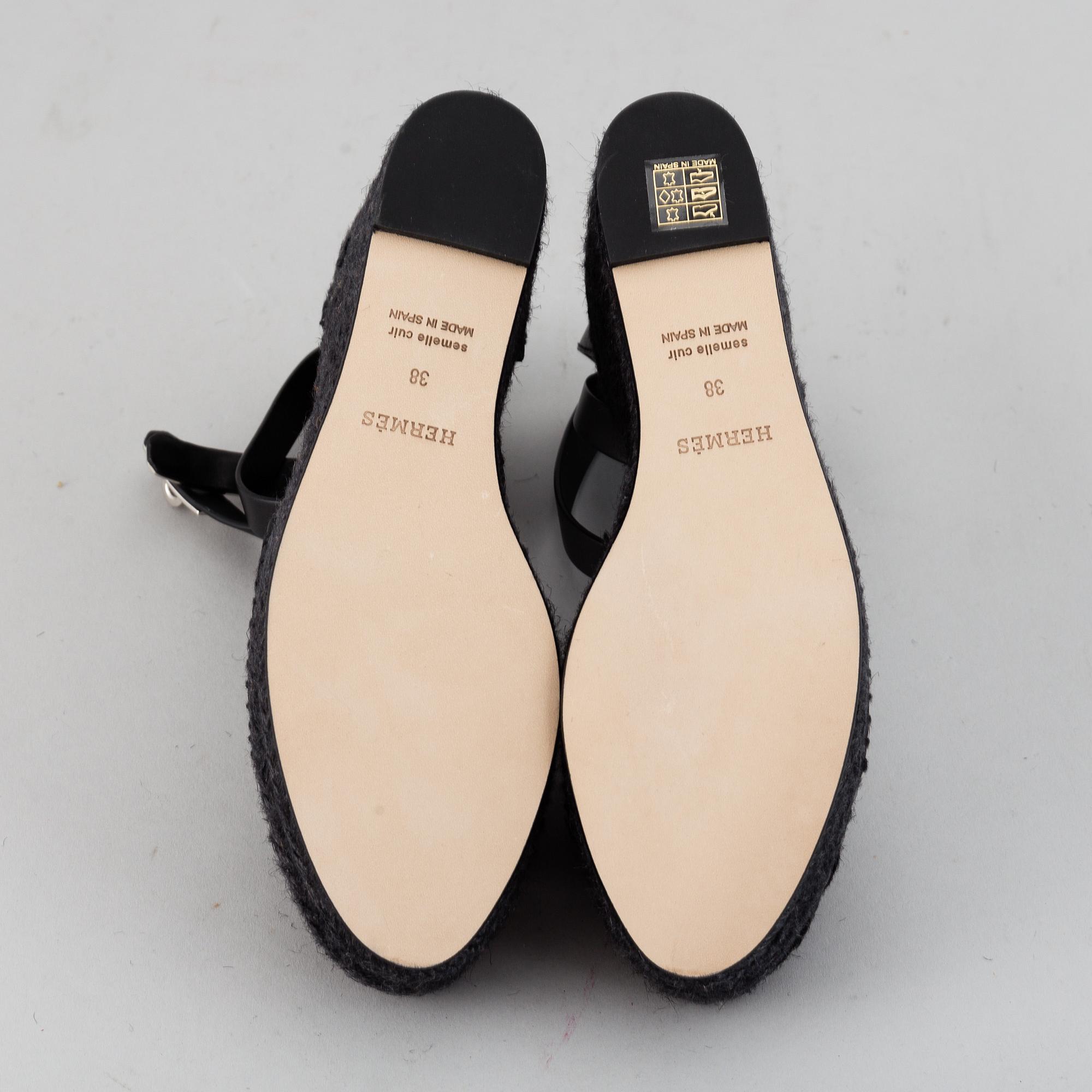 HERMÈS, a pair of black leather 'Tivoli' wedge sandals, 2019, size 38.