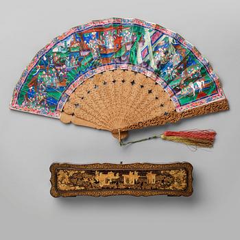 568. A chinese fan in a black lacquered box, Qing dynasty (1644-1912).