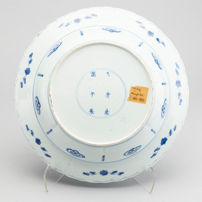 A large blue and white deep dish, Qing dynasty, with Kangxi six character mark and period (1662-1722).