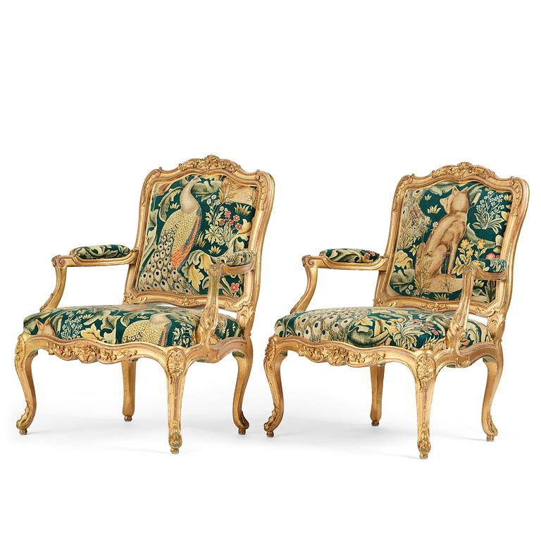 A pair of Louis XV-style giltwood fauteuils, late 19th century.