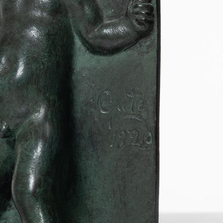 Axel Gute, a pair of patinated bronze bookends, dated 1920.