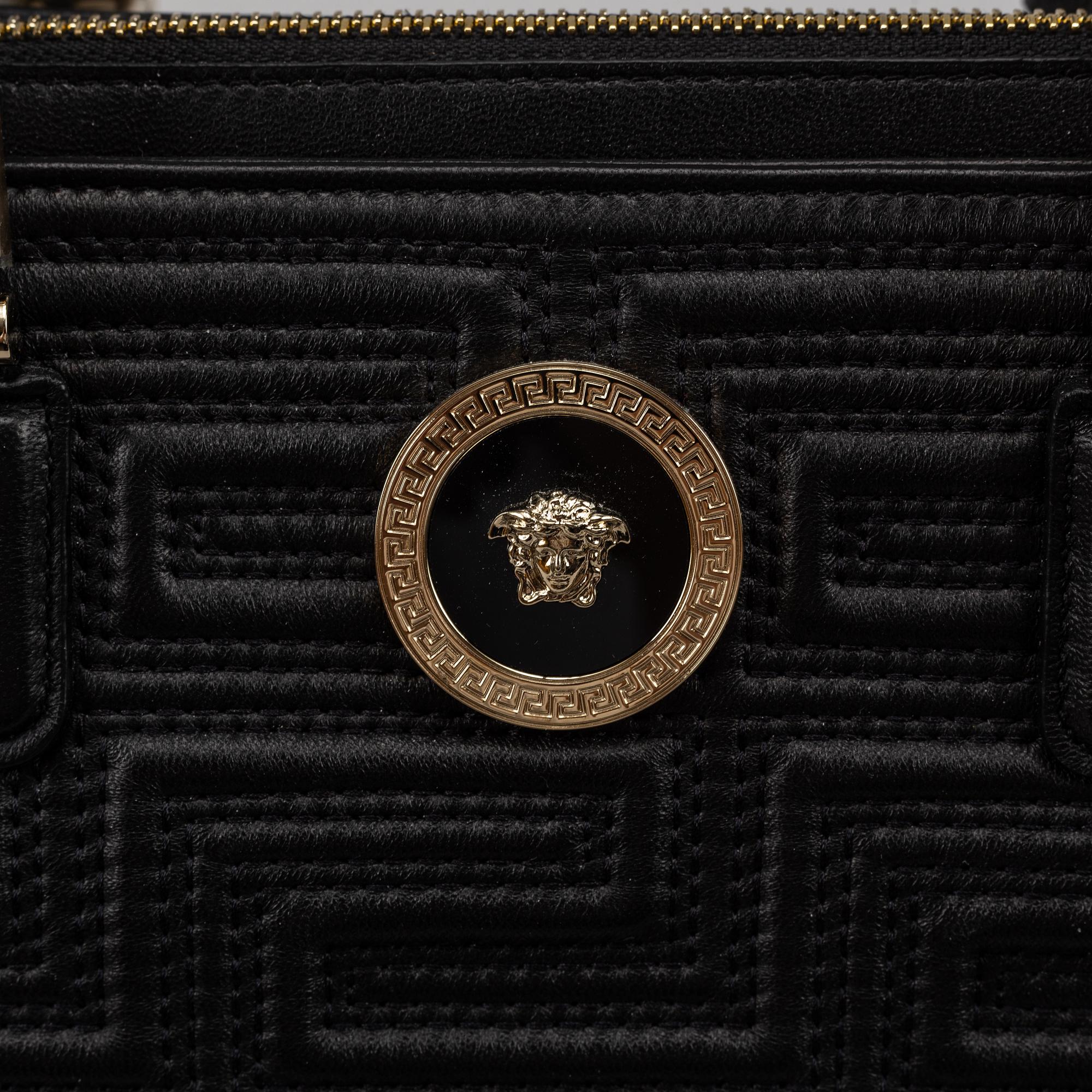 Versace, a black quilted leather handbag.
