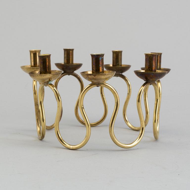 A brass candlestick designed by Lars Holmström for Firma Svenskt Tenn, second half of the 20th century.