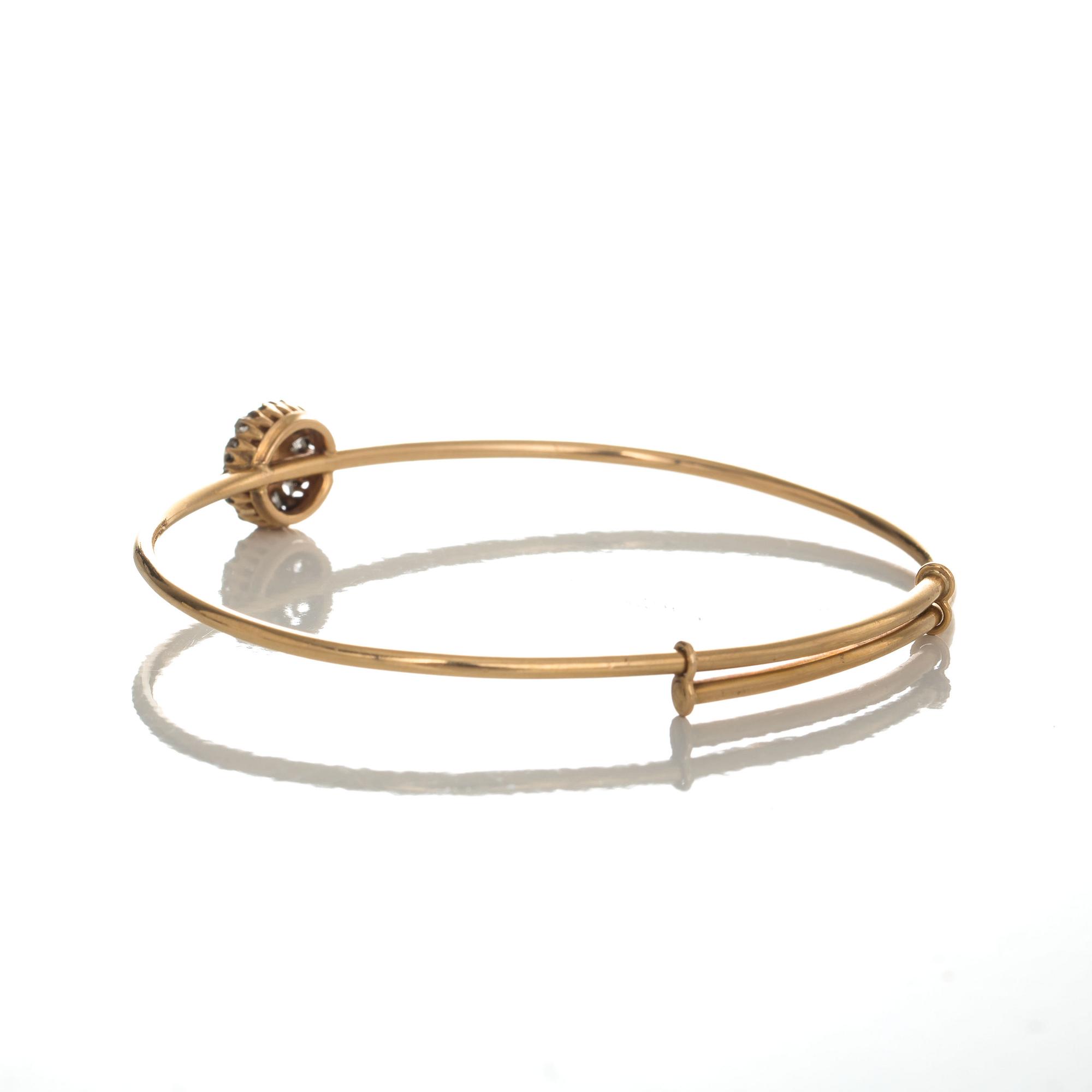 ARMRING, 18 k guld med odlad pärla samt rosenslipade diamanter. Dahlgren, Malmö, 1920. Vikt ca 12 g.