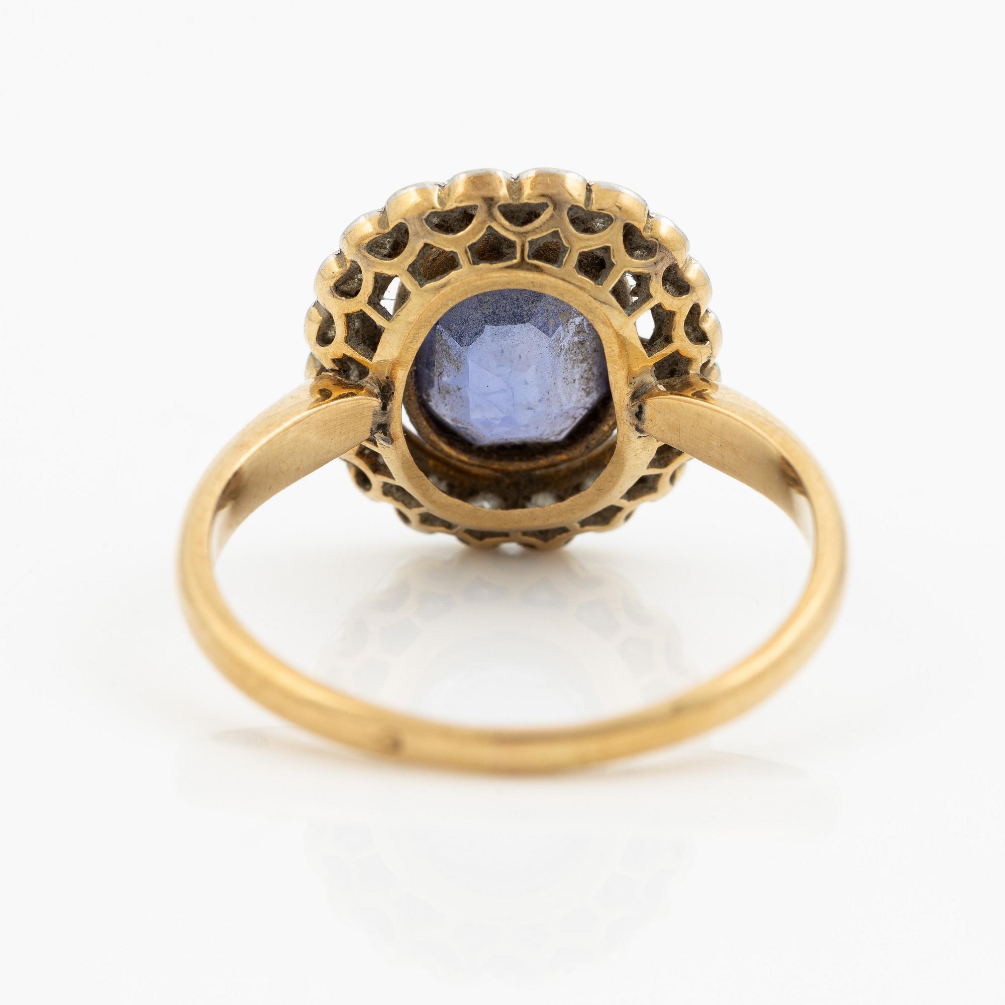 A ring in gold with a cushion-cut purple sapphire and old-cut diamonds, ca first half of the 20th century.