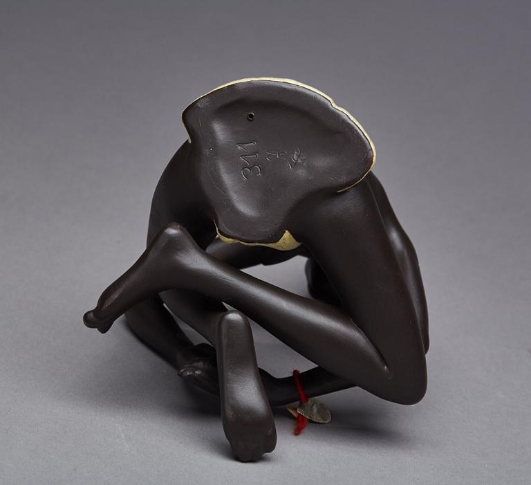 FIGURIN, etikettmärkt Goldscheider.