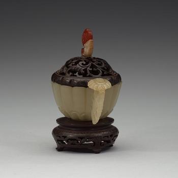 A nephrite cup with wooden cover and stand with silver inlay and quartz finial, Qing dynasty, 19th Century.