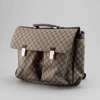 Gucci, a messenger bag.