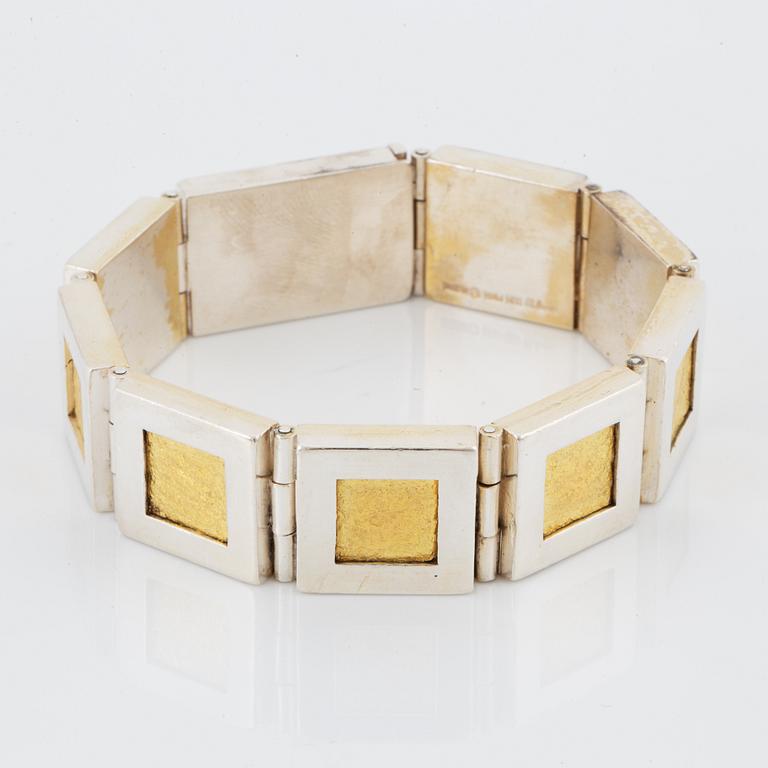 A Michael Hamma bracelet in silver and 18K gold.