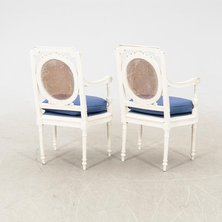 A pair of painted rattan Louis XVI style armchairs first half of the 20th century.