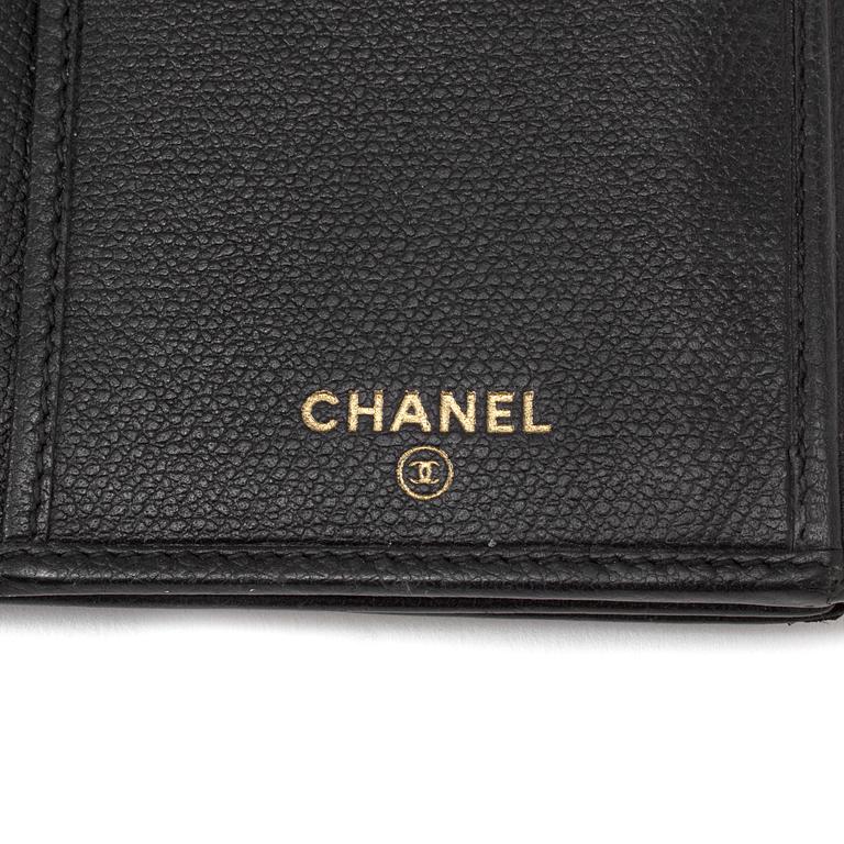 A black leather wallet by Chanel 2004/2005.