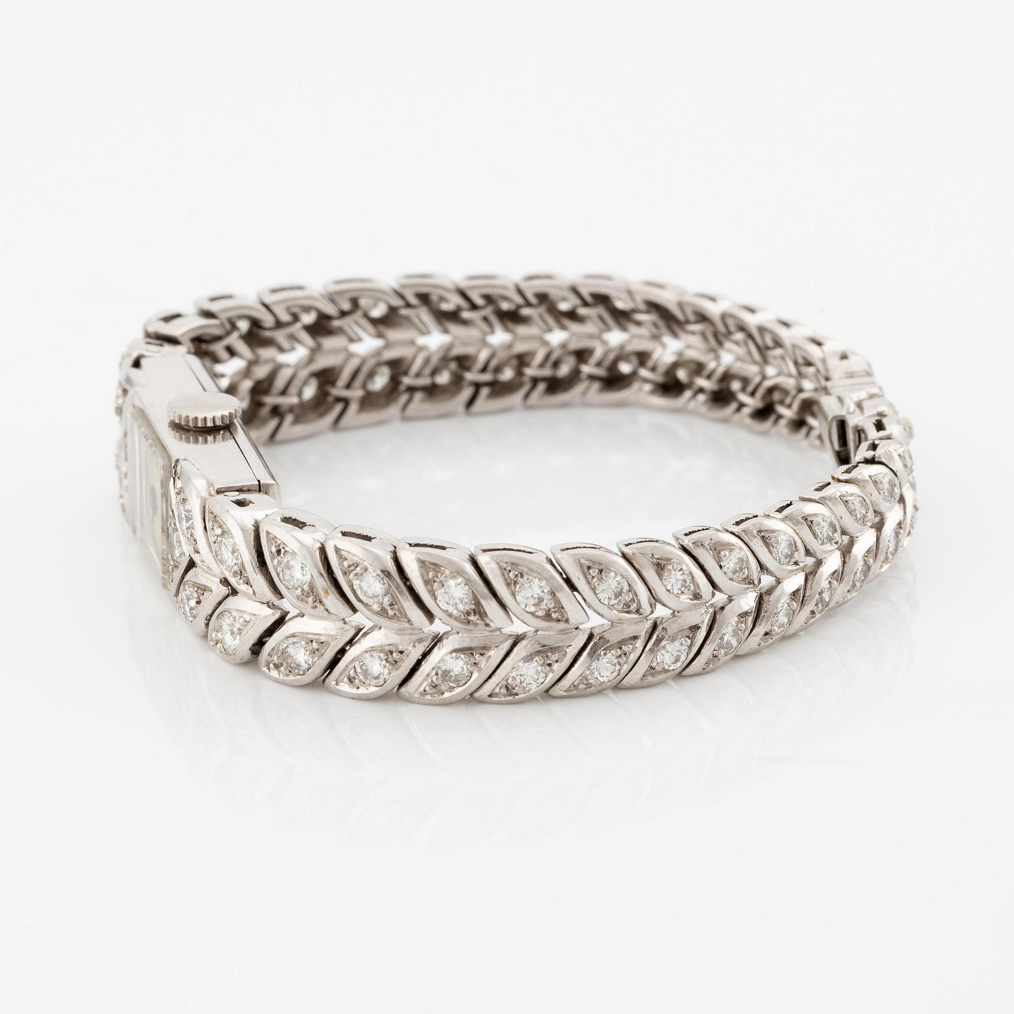 Sterlé armbandsur platina med runda briljantslipade diamanter.