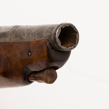 An early 19th Century flintlock pocket pistol.