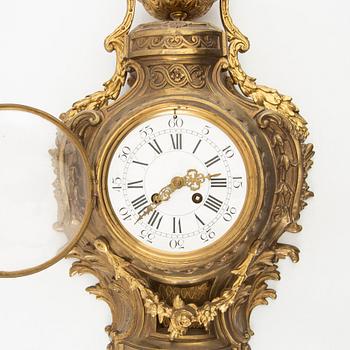 Wall clock in Louis XV style, circa 1900.