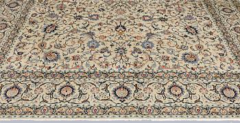 A Keshan carpet, signed, approx. 410 x 323 cm.
