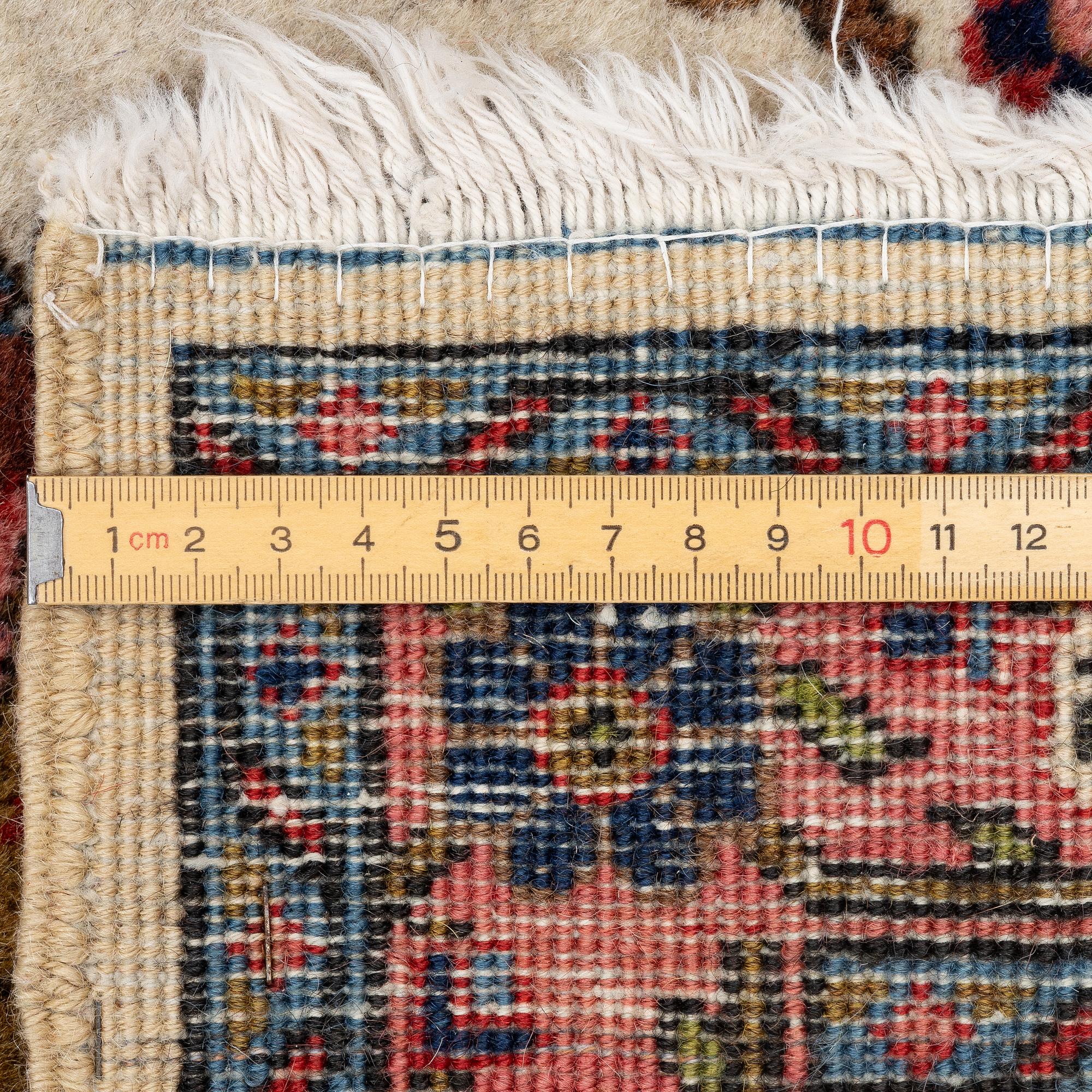 A semi-antique Tabriz carpet, c. 282 x 198 cm.