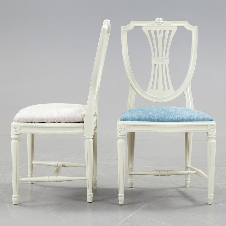 A set of a dozen white gustavian style chairs, second half of 20th century.