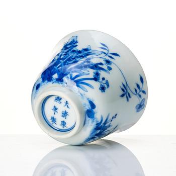 A blue and white month cup 'Narcissus', late Qing dynasty with Kangxi mark.