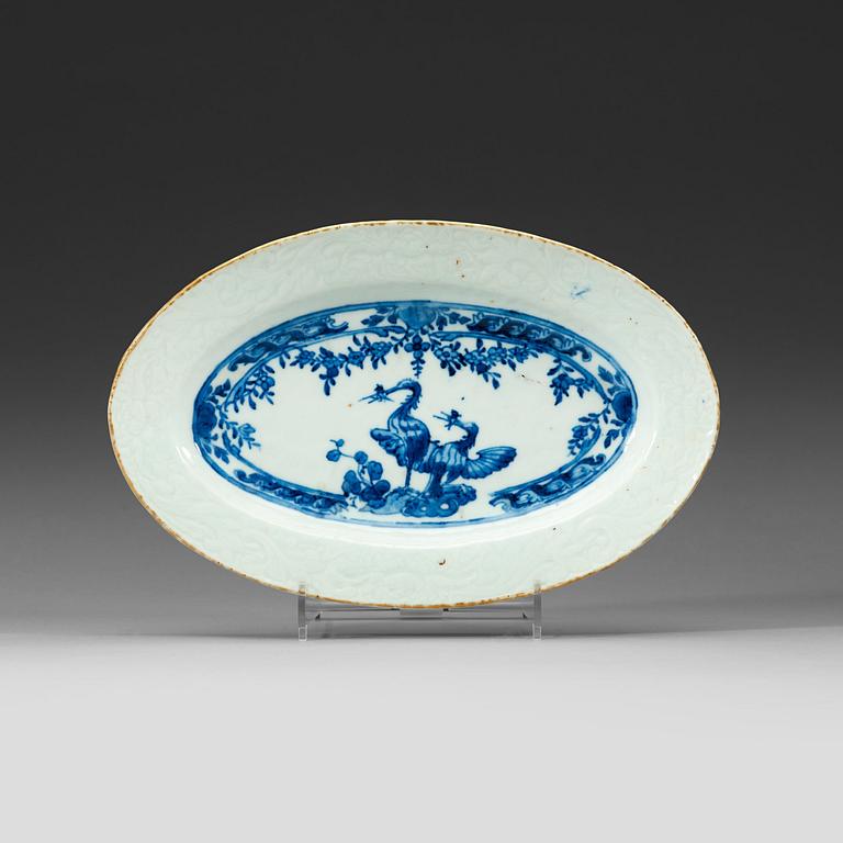 A blue and white armorial small charger with the arms of Grill, Qing dynasty, Qianlong (1736-95).