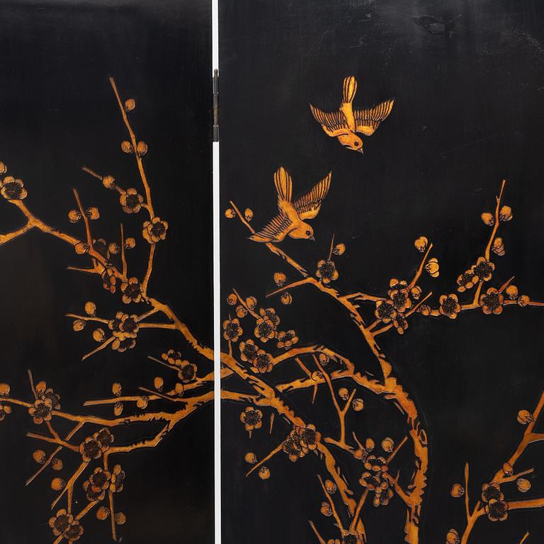 A Chinese lacquer folding screen, 20th century.