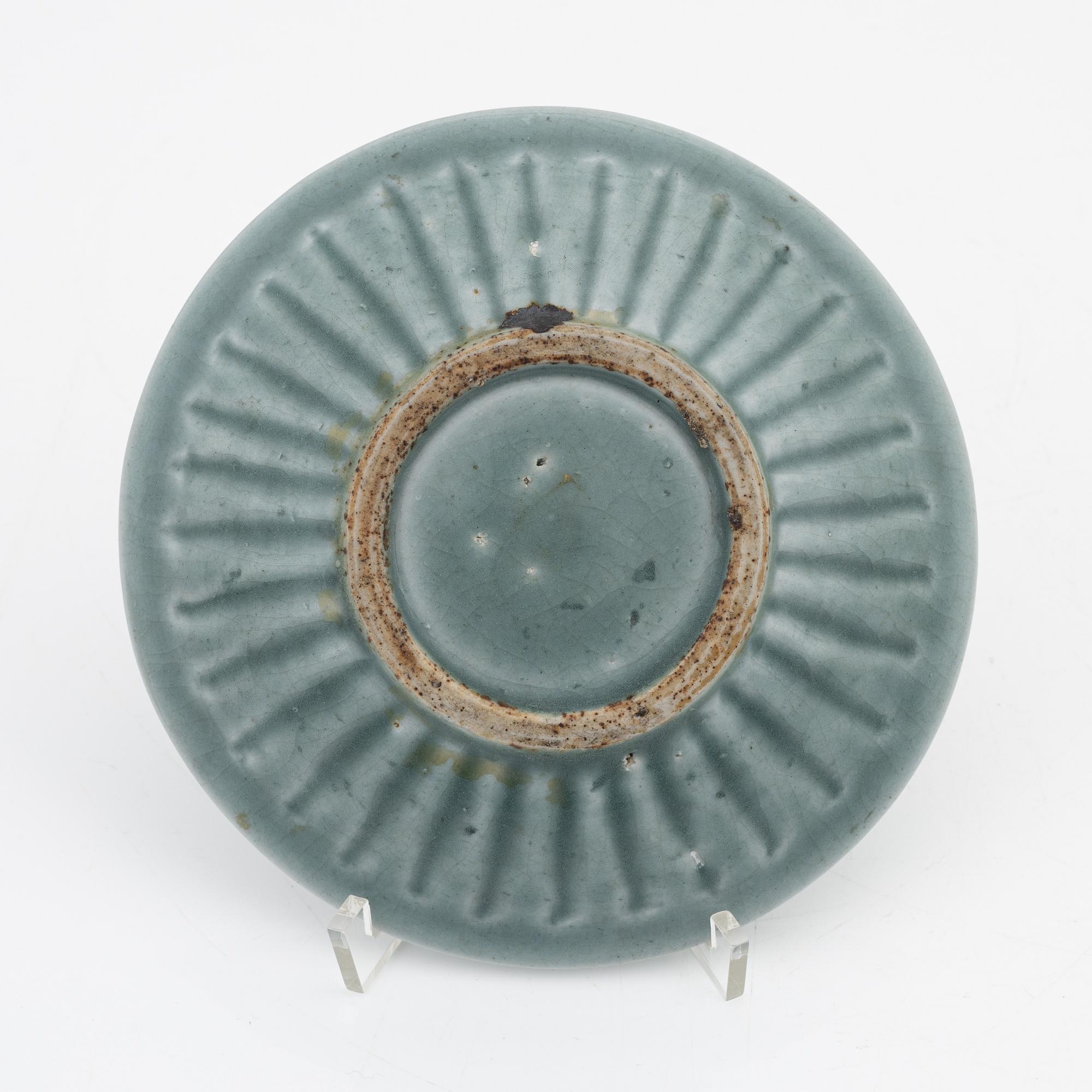 A celadon dish, for the south east asian market, double fish, Mingstyle, 20th Century. And a Chinese sealstone.