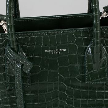 YVES SAINT LAURENT, a crocodile embossed green leather 'Sac du Jour Baby' bag, 2018.