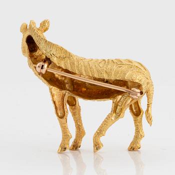 A Tiffany brooch in 18K gold set with sapphires designed as a zebra.