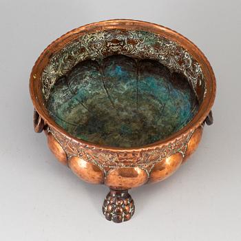 A 19th century copper champagne cooler.