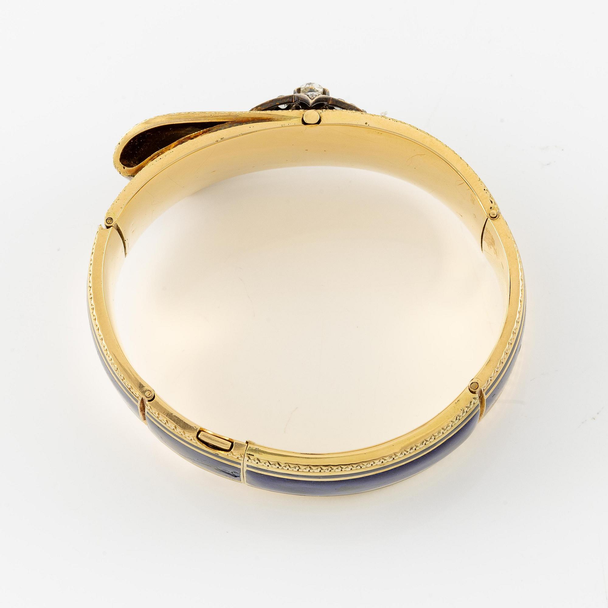 A bangle in 18K gold set with old-cut diamonds and blue enamel, France mid-19th century.