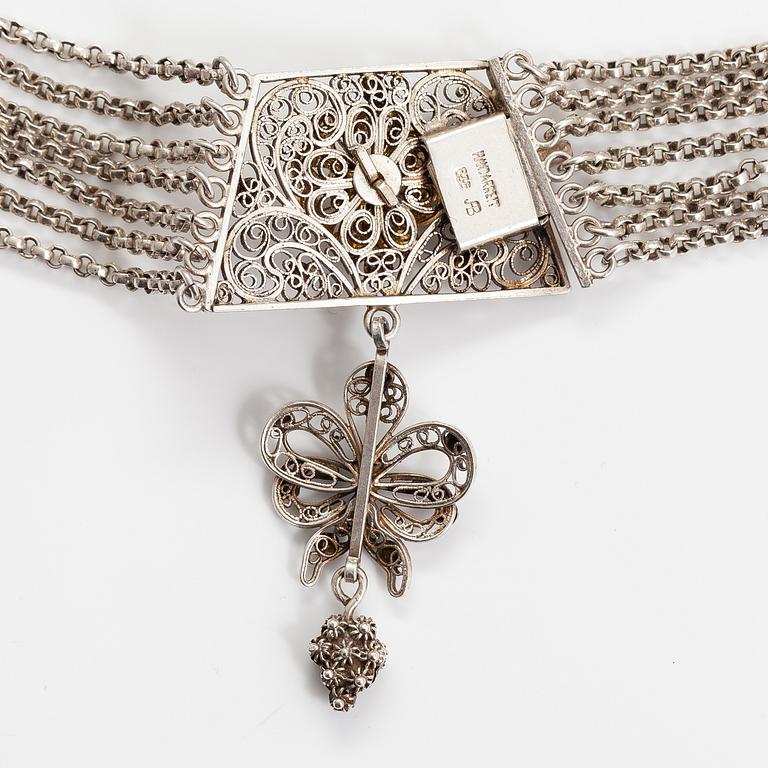 A silver necklace.